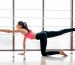 woman practicing yoga for PCOS management